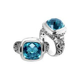Handcrafted Bali silver ring with cushion-cut Blue Topaz Quartz and artisan carvings.
